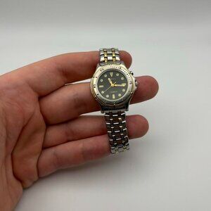 Vintage black face women’s Fossil watch with silver band!